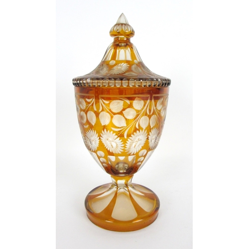 671 - A Bohemian amber flash and cut glass vase and cover