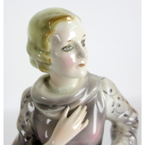 672 - A Continental pottery Art Deco figure of a lady