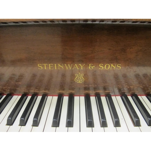 688 - A Steinway & Sons baby grand piano