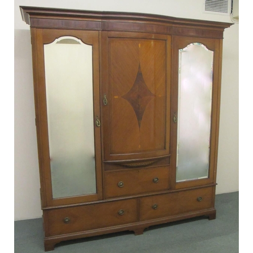 691 - An Edwardian mahogany bowfront inlaid wardrobe