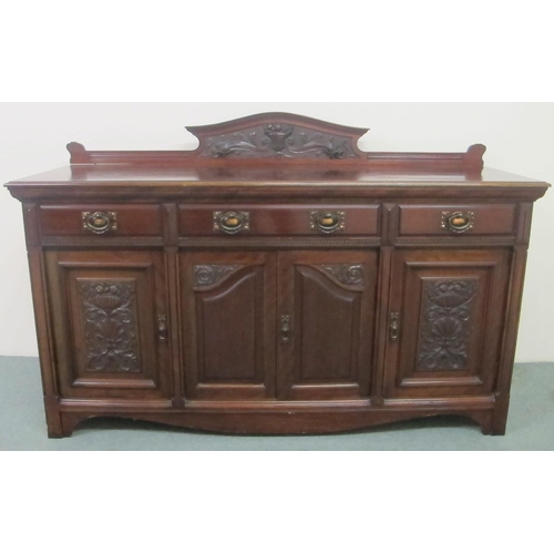 692 - An Arts and Crafts carved mahogany sideboard