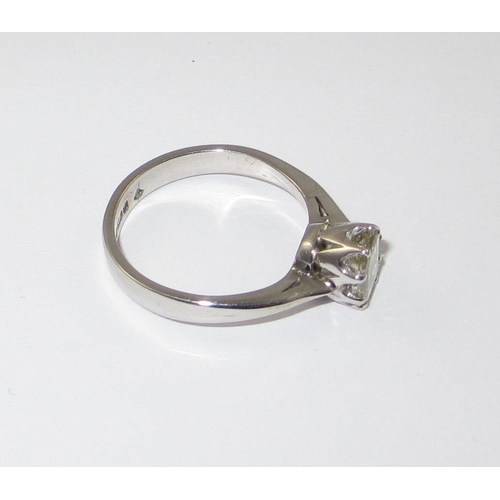 70 - A pale yellow diamond solitaire ring