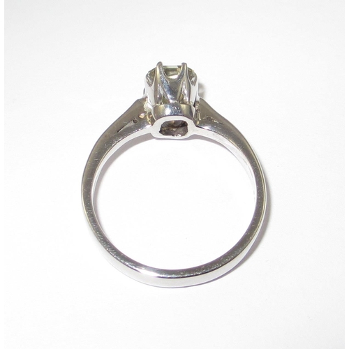 70 - A pale yellow diamond solitaire ring