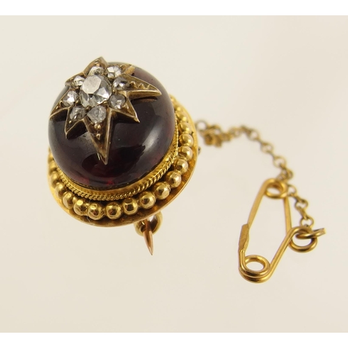 81 - A Victorian Garnet and diamond brooch