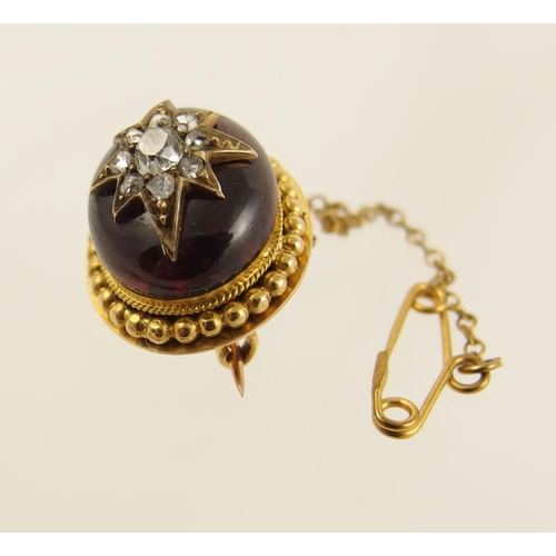 81 - A Victorian Garnet and diamond brooch