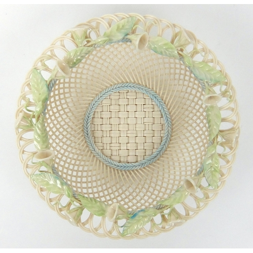 703 - A Belleek porcelain convolvulus four strand circular basket