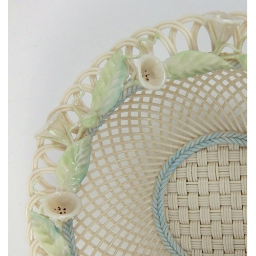 703 - A Belleek porcelain convolvulus four strand circular basket