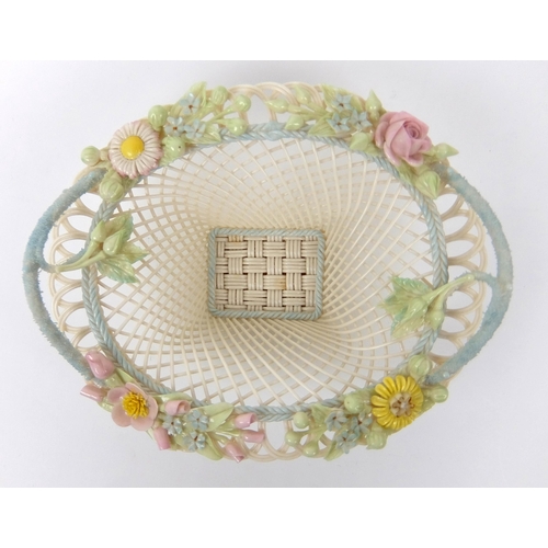 706 - A Belleek porcelain oval floral four strand basket