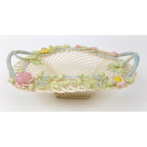 706 - A Belleek porcelain oval floral four strand basket