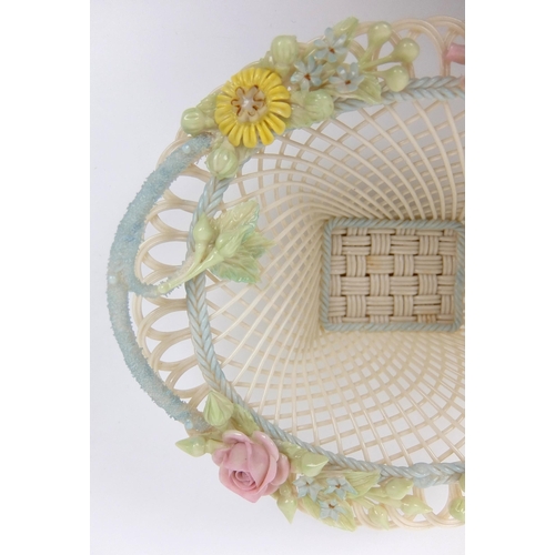 706 - A Belleek porcelain oval floral four strand basket