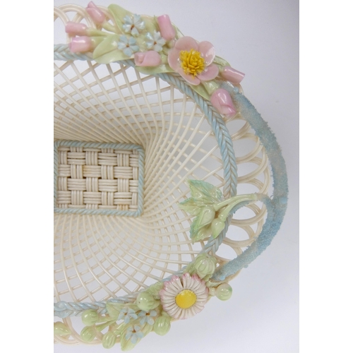 706 - A Belleek porcelain oval floral four strand basket