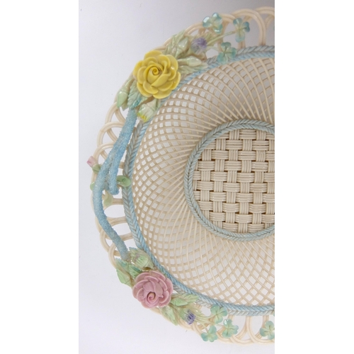 707 - A Belleek porcelain four strand circular floral basket