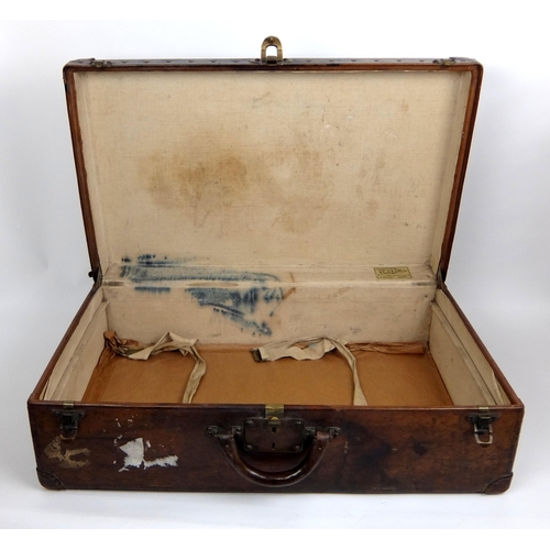 708 - An early 20th century Louis Vuitton Brown leather suitcase