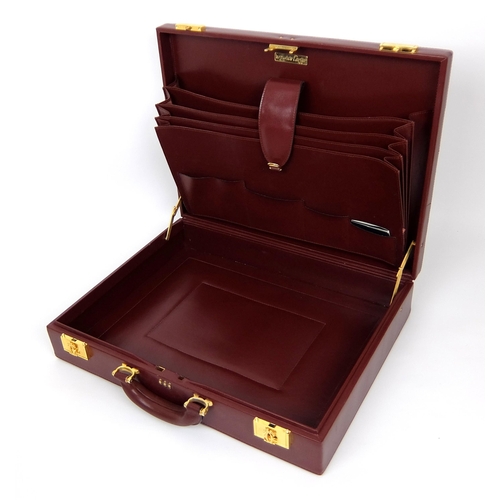 711 - A Cartier burgundy leather and suede briefcase