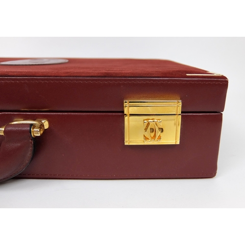 711 - A Cartier burgundy leather and suede briefcase