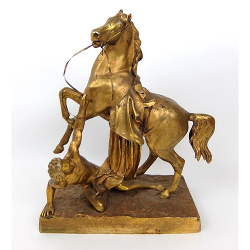 713 - A 19th Century gilded and cast metal stallion with dying Gaul