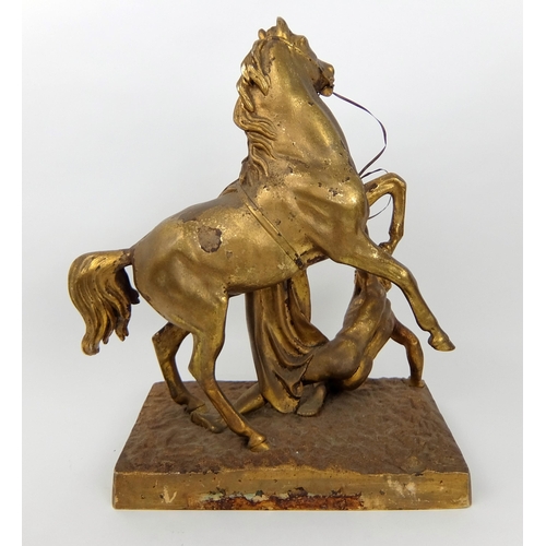 713 - A 19th Century gilded and cast metal stallion with dying Gaul