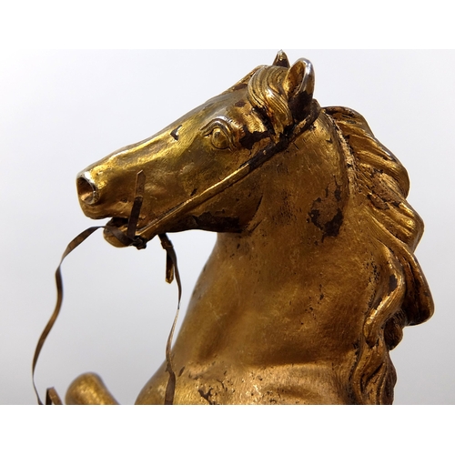 713 - A 19th Century gilded and cast metal stallion with dying Gaul