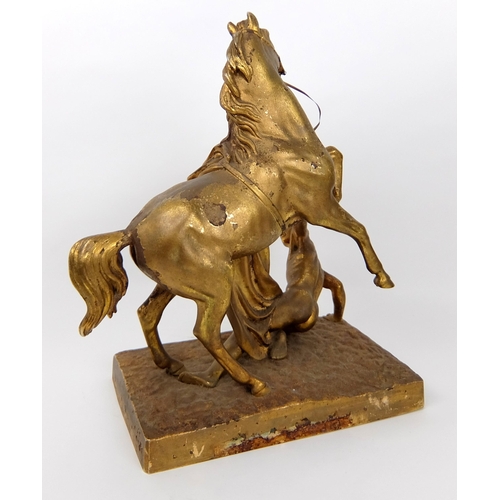 713 - A 19th Century gilded and cast metal stallion with dying Gaul