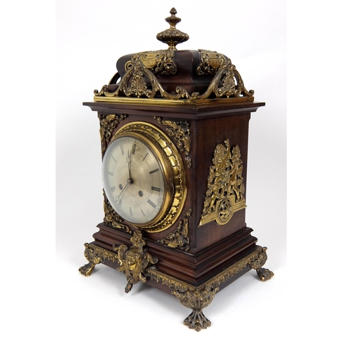 716 - A late 19th/early 20th Century mahogany mantle clock