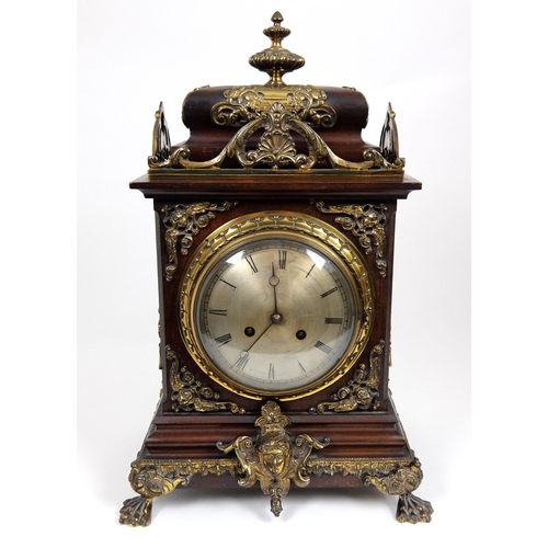 716 - A late 19th/early 20th Century mahogany mantle clock