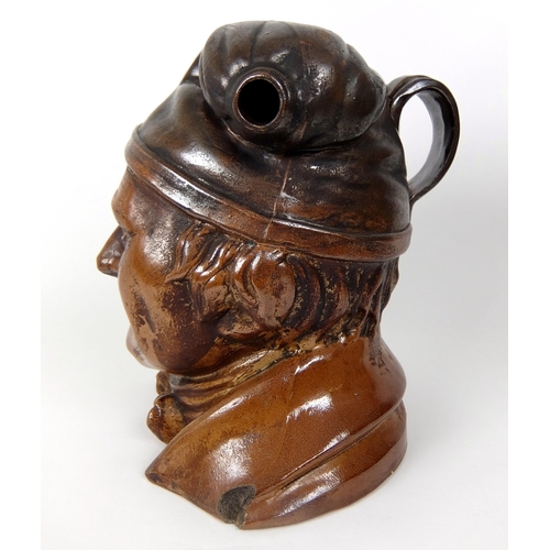 723 - A 19th Century Scottish stoneware 'Soutar Johnny' whisky flagon