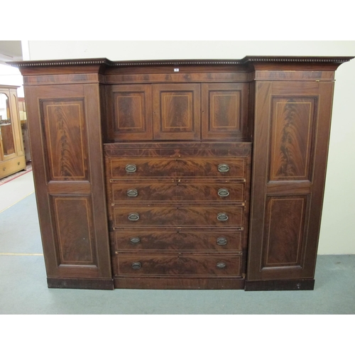 793 - An Edwardian mahogany inlaid breakfront princess wardrobe