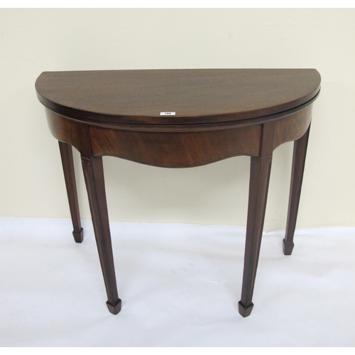 796 - A Victorian mahogany demi-lune fold over card table