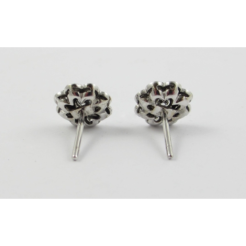 20 - A pair of diamond flower earrings