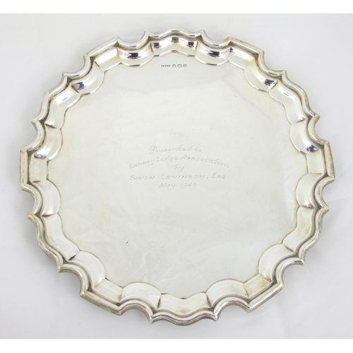 210 - A silver presentation salver by H Fisher & Company  Sheffield 1946