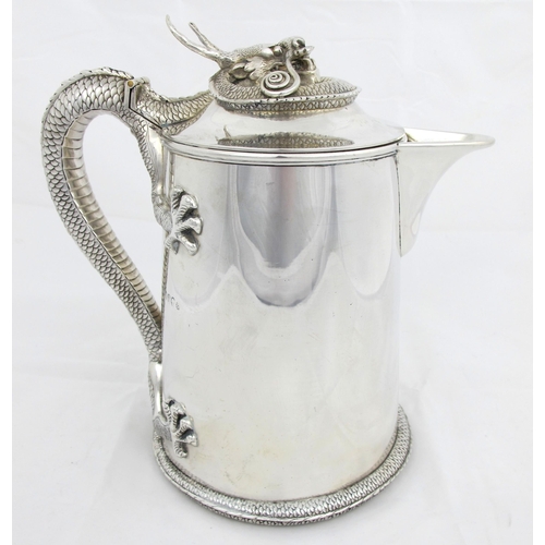 211 - A Victorian silver lidded jug  maker's marks indistinct  London 1875