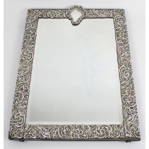 213 - An Edwardian silver mounted easel mirror by Charles Henry Dumenil  London 1909