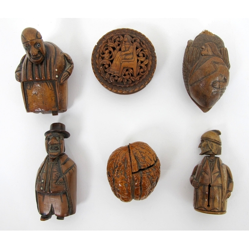 316 - A group of early 19th Century carved treen and nut snuff boxes  pill boxes and miniature chess set i... 