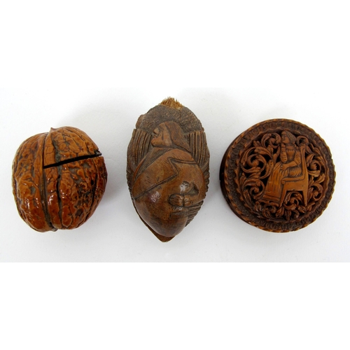 316 - A group of early 19th Century carved treen and nut snuff boxes  pill boxes and miniature chess set i... 