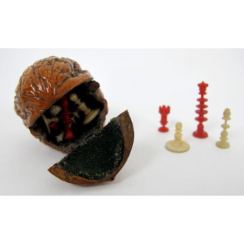 316 - A group of early 19th Century carved treen and nut snuff boxes  pill boxes and miniature chess set i... 