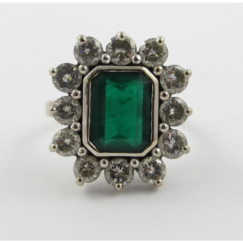 62 - An 18ct white gold emerald and diamond ring