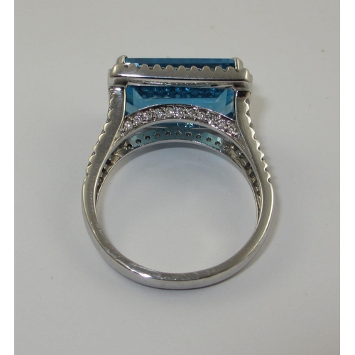 75 - A blue topaz and diamond dress ring