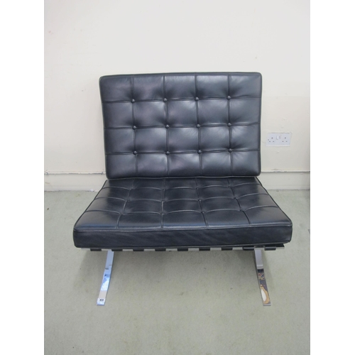 823 - A modern Barcelona black leather and chrome chair