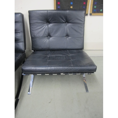 827 - A modern Barcelona black leather and chrome chair