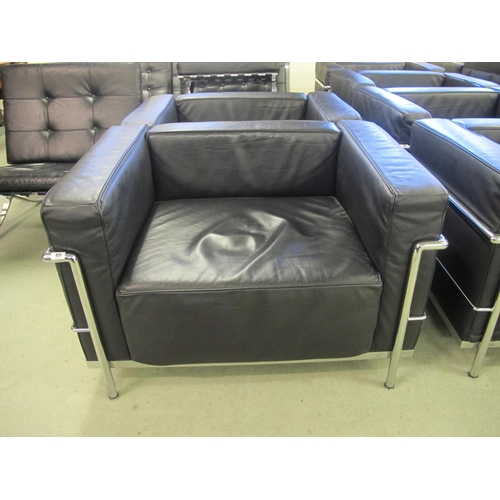 831 - A modern LC/2 black leather and chrome armchair designed by Corbusier