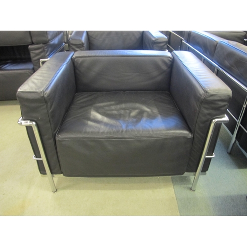 832 - A modern LC/2 black leather and chrome armchair designed by Corbusier