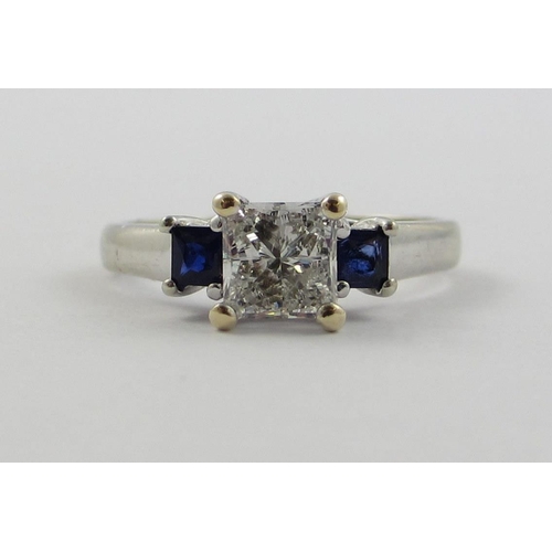 84 - A princess cut diamond and sapphire ring