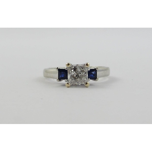 84 - A princess cut diamond and sapphire ring