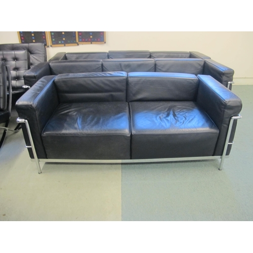 840 - A modern black leather and chrome two seater settee designed by Corbusier