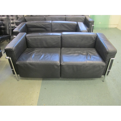 841 - A modern black leather and chrome two seater settee