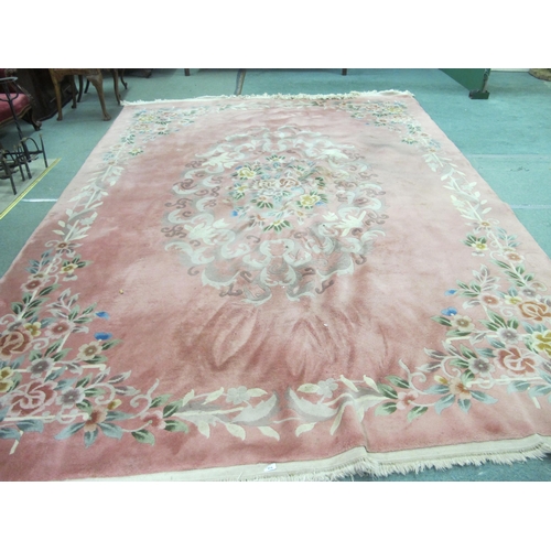 851 - A Chinese floral decorated carpet