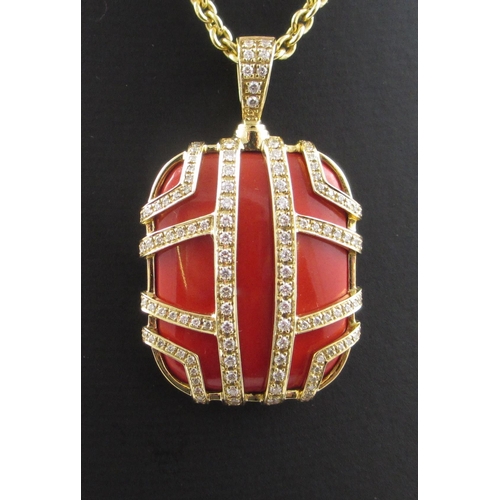 91 - A diamond and coral coloured pendant