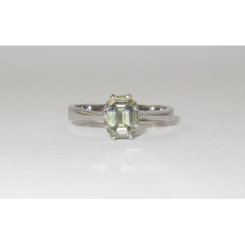 94 - A pale yellow diamond solitaire ring