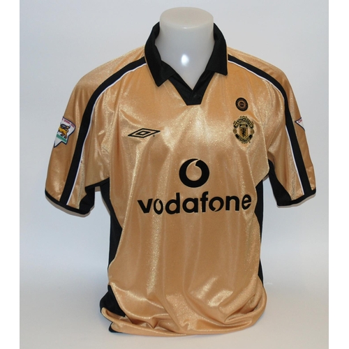 184 - A gold Manchester United short-sleeved shirt