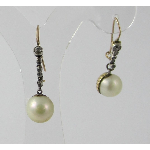 35 - A pair of pearl and diamond earrings.